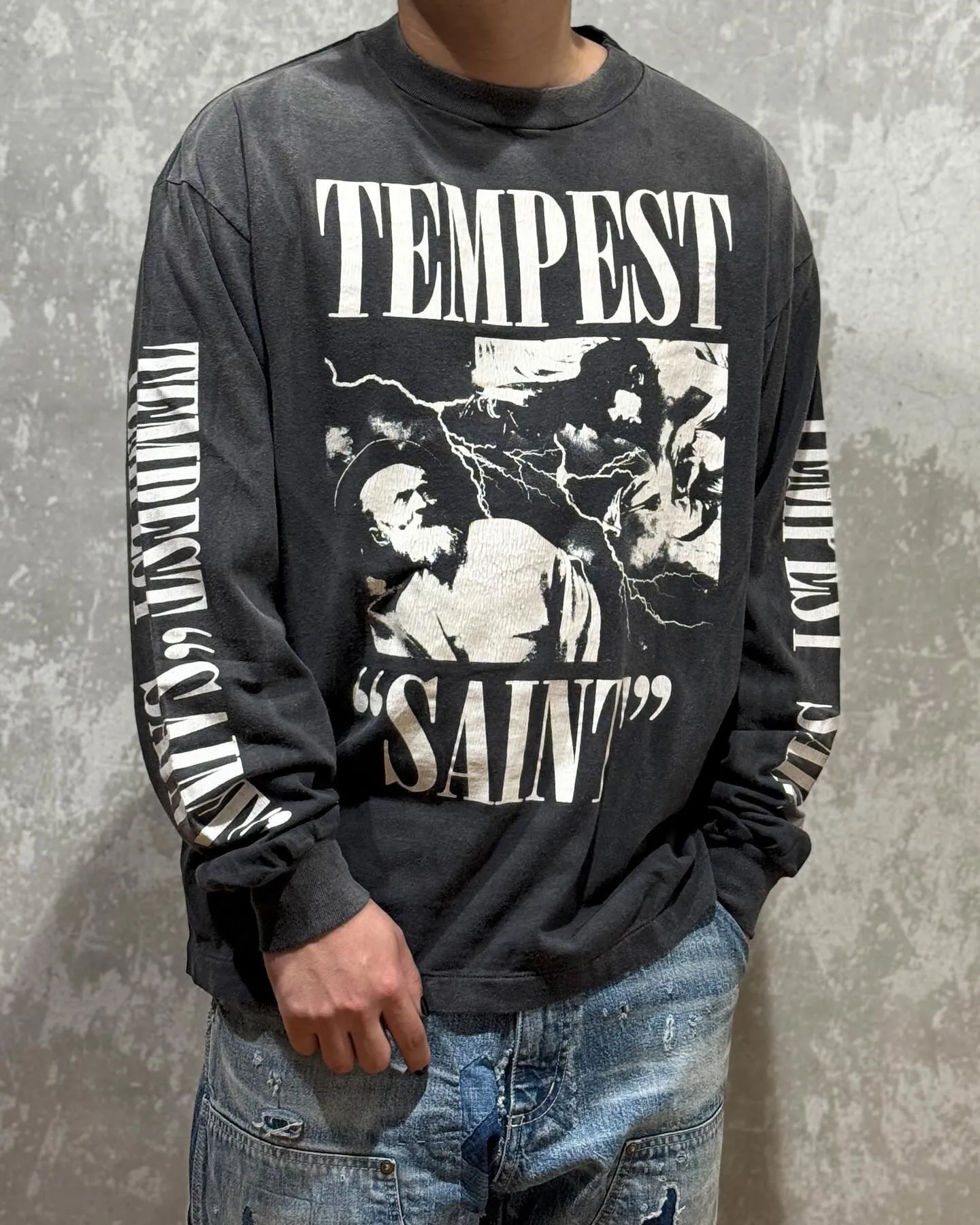 SAINT Mxxxxxx LS TEE/TEMPEST/BLK 'TEMPEST SAINT' Storm Religious Saints Cracked Retro Vulcanized Heavy Wash Long Sleeves Washed Black S-XL Assute Dyeing Multi-bit Horse Fading Craftsmanship Grinding and Hanging Holes Full of Old Feeling Top Printing Craftsmanship Purchasing Level